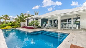 A modern house with a swimming pool, outdoor seating, and a covered patio area. - Tranquillit, TOP NOTCH (BANKSIA BEACH)