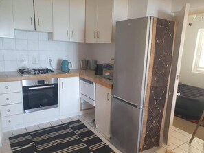 Vila standard, sacada, vista para o mar | Cozinha privada