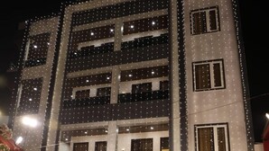 A building with a sign reading "AWADHGRAND" at the top. - Hotel Awadh Grand (Kanpur)