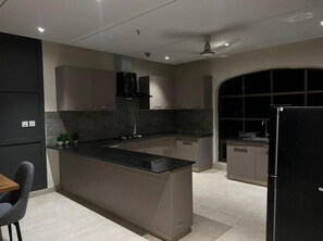 Apartment | Private kitchen | Mini-fridge, microwave, oven, stovetop - Luxor Apartments & Suites - Indigo (Lahore)
