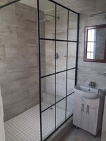 Deluxe Suite, Balcony, Mountain View | Bathroom | Slippers, towels, soap, shampoo