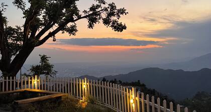 Panoramic views of the Doon Valley and Mussoorie Hills - A Serene Hideaway.