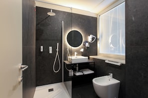 Deluxe Single Room, Courtyard View | Bathroom | Shower, hair dryer, slippers, towels