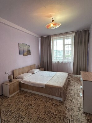 Apartamento familiar, vistas a la ciudad | Cortinas opacas y sistema de insonorización