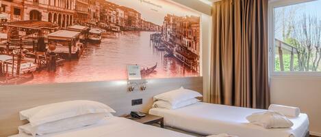 A hotel room with two beds, a large wall mural of Venice, a window with curtains, and a 'holiday please do not disturb' tag.