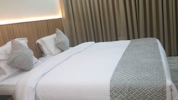 City Room | Premium bedding, memory foam beds, laptop workspace, blackout drapes