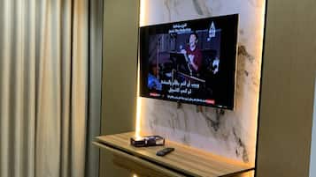 Premium bedding, memory-foam beds, laptop workspace, blackout curtains