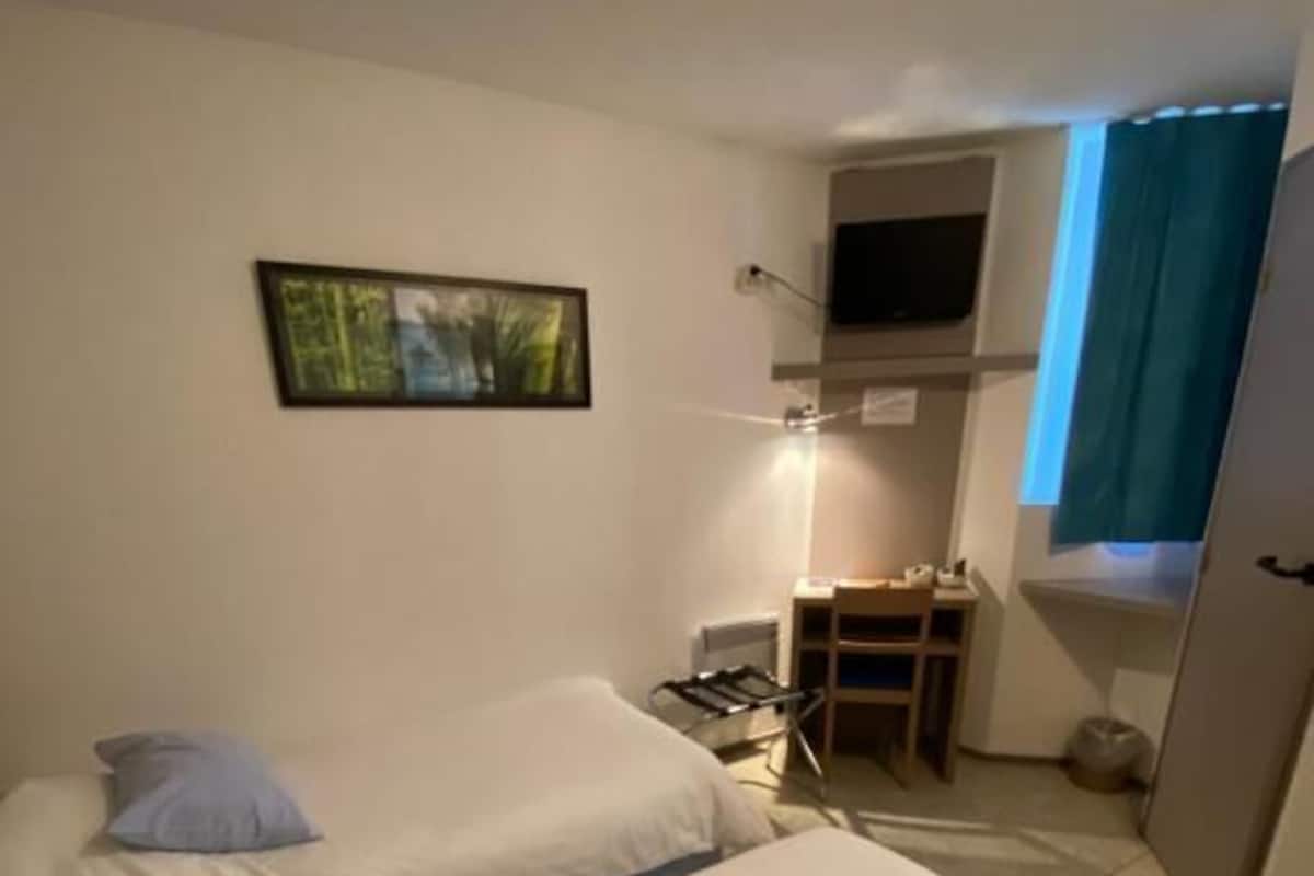 Twin Room, Garden View | Blackout drapes, iron/ironing board, free WiFi, wheelchair access