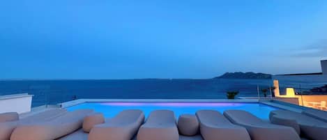 Outdoor pool, open 9:00 AM to 10:00 PM, pool umbrellas, pool loungers