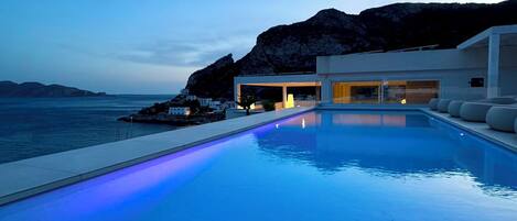 Outdoor pool, open 9:00 AM to 10:00 PM, pool umbrellas, pool loungers