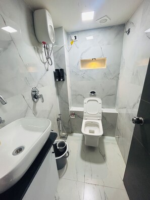 Deluxe Double Room, City View | Bathroom | Shower, free toiletries, slippers, towels - Hotel The Season (Ahmedabad)