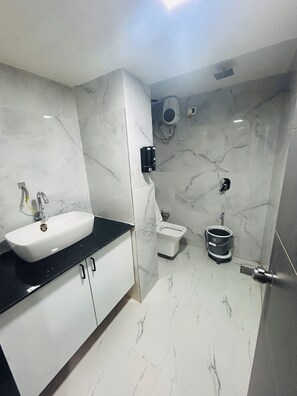 Deluxe Double Room, City View | Bathroom | Shower, free toiletries, slippers, towels - Hotel The Season (Ahmedabad)