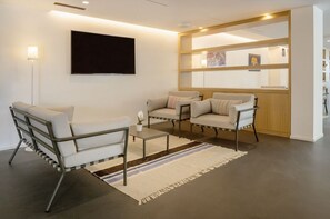 Interior - A modern, tastefully furnished hotel room of approximately 22 square meters, featuring a double bed or two single beds, a bathroom with a bathtub or shower, and a large balcony furnished with a table and chairs.Use of swimming pool and gymWellness center (Olbia)