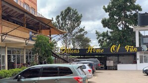 A building with a sign reading "Dillons Home Of Fun". - Dillons Highway Motel (Kilimambogo)