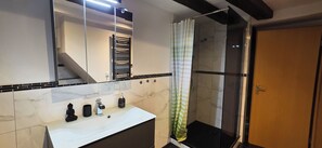 Shower, hair dryer, towels, soap