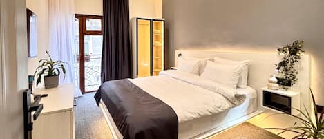 Deluxe Double Room, Garden View | In-room safe, blackout drapes, soundproofing, iron/ironing board