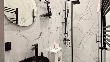 Deluxe Double Room, Garden View | Bathroom | Hair dryer, slippers, towels, soap