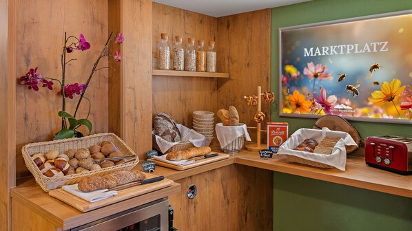 A bakery display with various breads and pastries, a wooden counter, and a sign reading "MARKTPLATZ".