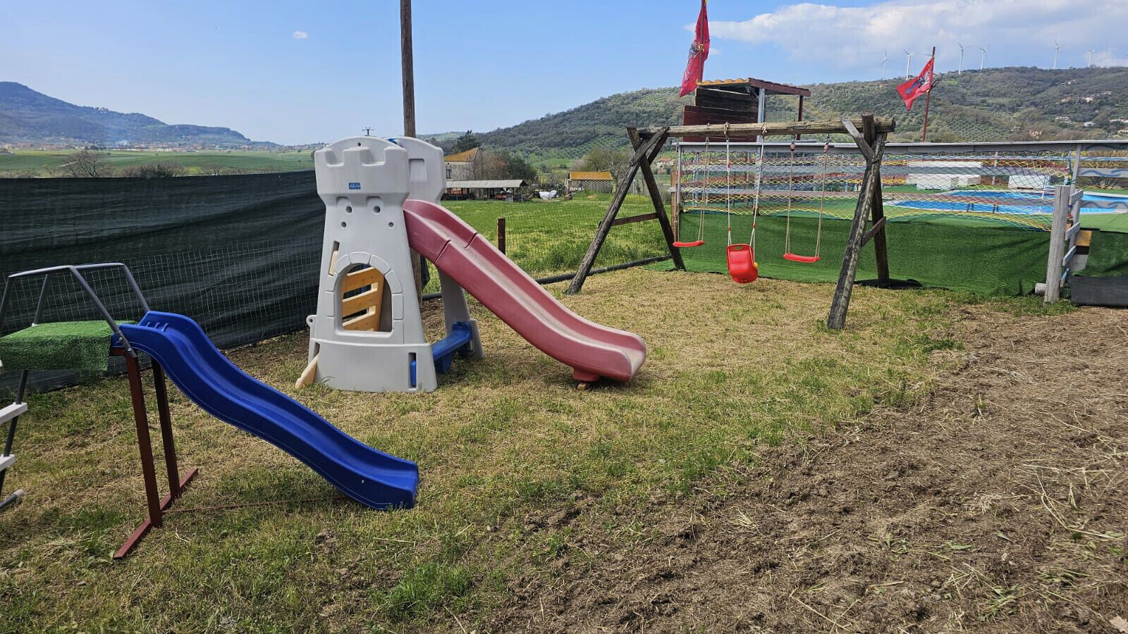 A playground with slides and swings.