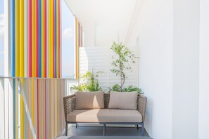 Property grounds - Modern, tastefully furnished hotel room of approximately 28 square meters, featuring a double bed and a single bed, a bathroom with a bathtub or shower, and a large balcony furnished with a table and chairs.Use of the pool and gymUnlimited access to the  (Olbia)