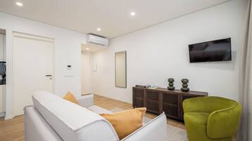 Family Studio | Living area | Flat-screen TV
