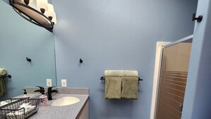 A bathroom with two sinks, a towel rack, and a shower. - Welcome to Wapato Point, Manson, WA (Manson)