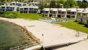 A coastal hotel with multiple buildings, a swimming pool, and a beach area. - Welcome to Wapato Point, Manson, WA (Manson)