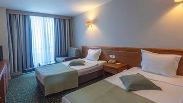 Deluxe Room, Balcony, Sea View | In-room safe, laptop workspace, blackout drapes, free WiFi