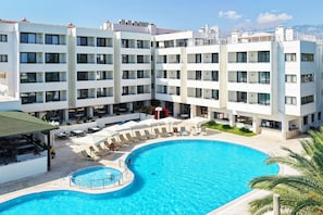 Seasonal outdoor pool, pool umbrellas, pool loungers