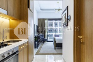 Apartment, Balcony, City View | Iron/ironing board, free WiFi - Bloomfields Comfortable Stu Azizi (Dubai)