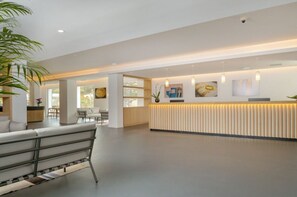 Lobby - Modern, tastefully furnished hotel room of approximately 28 square meters, featuring a double bed and a single bed, a bathroom with a bathtub or shower, and a large balcony furnished with a table and chairs.Use of the pool and gymUnlimited access to the  (Olbia)