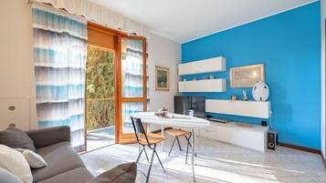 Basic Apartment, Balcony | Living area | 35-cm TV with digital channels