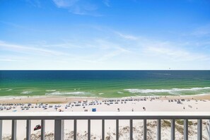 A beach with a clear view of the ocean and a balcony overlooking the beach. - Lighthouse 1215 by Liquid Life (Gulf Shores)