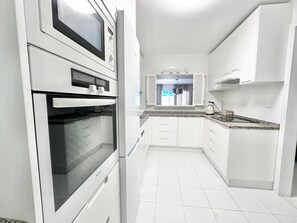 Family Apartment, Balcony, Pool View | Private kitchen | Toaster