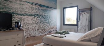 Room with bathtub and unlimited access to an outdoor spa.