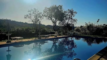 Seasonal outdoor pool, pool umbrellas, pool loungers