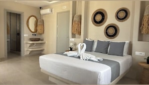 Deluxe Suite, Private Bathroom, Sea View | In-room safe, laptop workspace, blackout drapes, soundproofing - EvMaria Suites (Santorini)