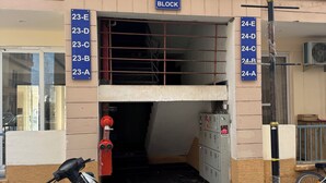 A building entrance with a sign indicating blocks 23-E to 24-A. - Twin Nest 2BHK | AC |Gated | Near Chandigarh Univ. (Mohali)
