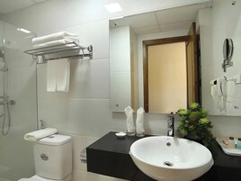 Combined shower/bathtub, designer toiletries, hair dryer, bathrobes