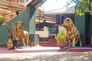 A building entrance with a covered porch and steps leading up to a door. - Blue Hills Resort Sagana (Sagana)