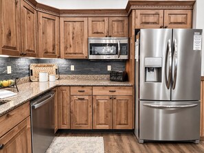 Stainless steel appliances and large counter space make cooking enjoyable. - SKI IN/OUT @ Lift > Shuffleboard, Hot Tub, Pool Table, PS5, 7 bedrooms (Snowshoe)