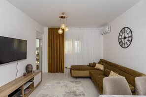 Deluxe Apartment, Balcony, City View | Living area - Alpha Mare (Bar)