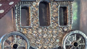 A keychain shaped like a train with a chain attached. - Westside Charmer, located in Ukiah, CA. (Ukiah)