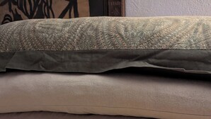 A stack of four pillows with different patterns and textures. - Westside Charmer, located in Ukiah, CA. (Ukiah)