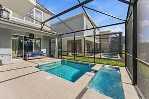 Outdoor pool, a heated pool - Reunion 5BR Home w/ Pool – 15min to Disney (Kissimmee)