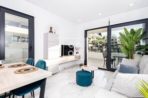 TV - Orihuela Poolside Retreat, High-end apt, Pool views - by OYOOSTAYS (Orihuela)