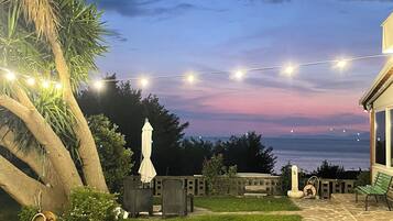 Quarto casal conforto, vista para o jardim | Terraço/pátio