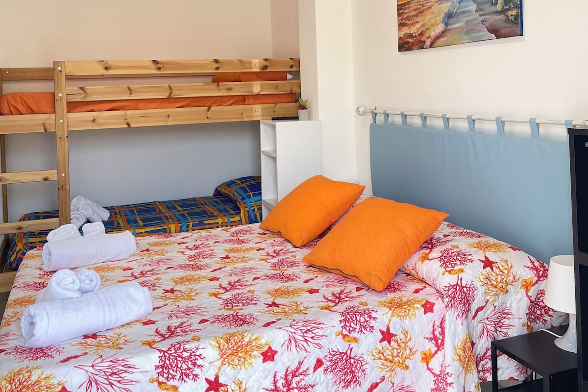 Family Quadruple Room, Courtyard View | Desk, blackout drapes, iron/ironing board, free WiFi
