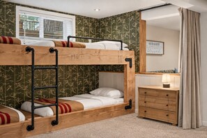 A bunk bed room with a wooden ladder, a dresser, and a mirror. - Private Sauna + Hot Tub - Mins to Mt. Bachelor (Bend)