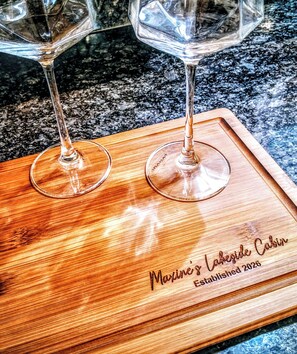 Two wine glasses on a wooden tray with engraved text. - NEW! Sleeps 5 on Lake Kathy, close to I 75 interstate, Rest, Relax, Fish, Repeat (Tunnel Hill)